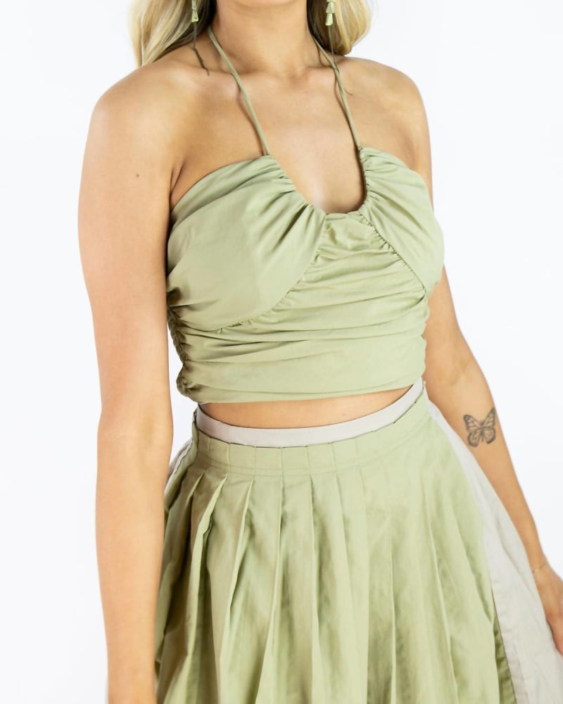Front of a model wearing a size LARGE Spaghetti Strap Crop Top In Olive Green in Olive Green by MOON RIVER. | dia_product_style_image_id:344803
